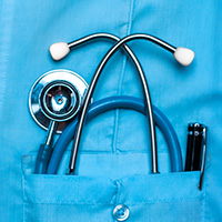 Photo of a stethoscope in a physician's pocket.