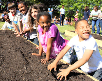 Kids participate in community gardening
