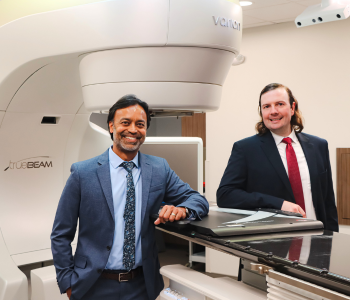 Radiation oncologists Dr. Anil Dhople and Dr. Jason Sanders with a Varian TrueBeam with HyperSight linear accelerator