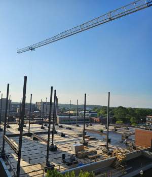 Tower crane hoisting steel for patient tower at Tanner-Carrollton