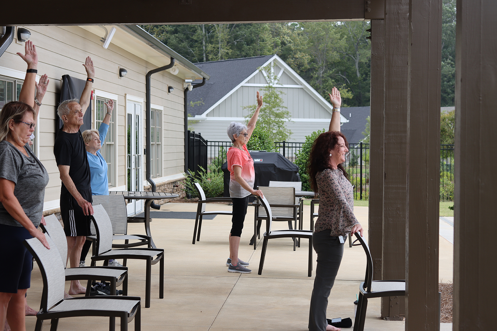 Group of seniors doing chair yoga